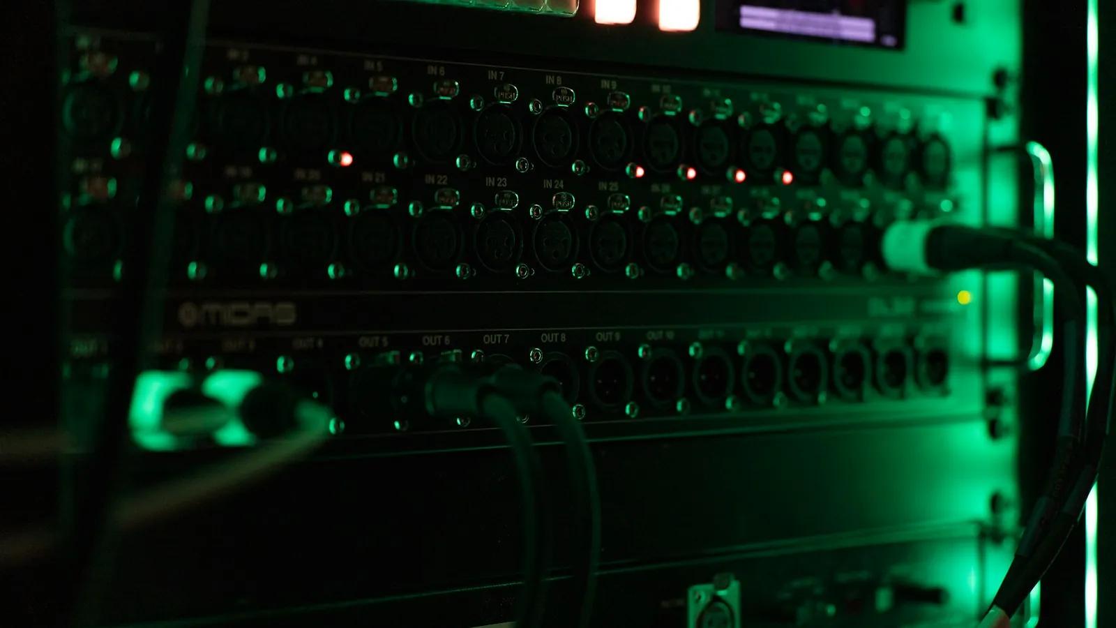 Close-up of a server front panel with green status lights