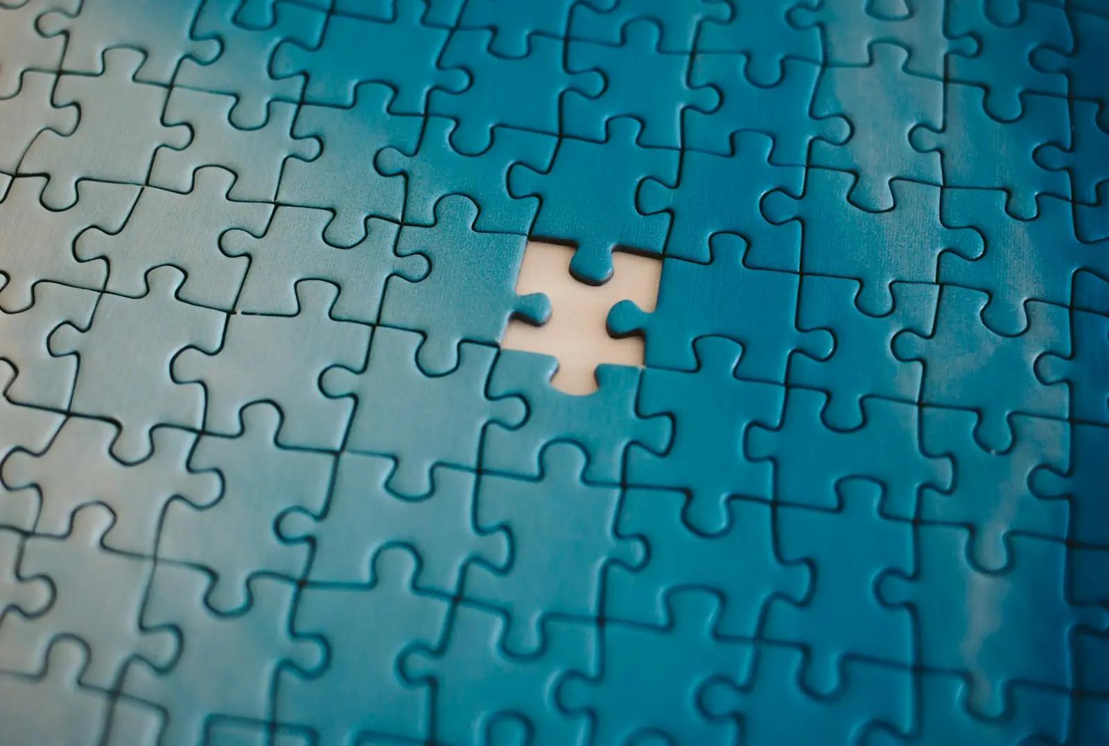 A jigsaw puzzle with one piece missing