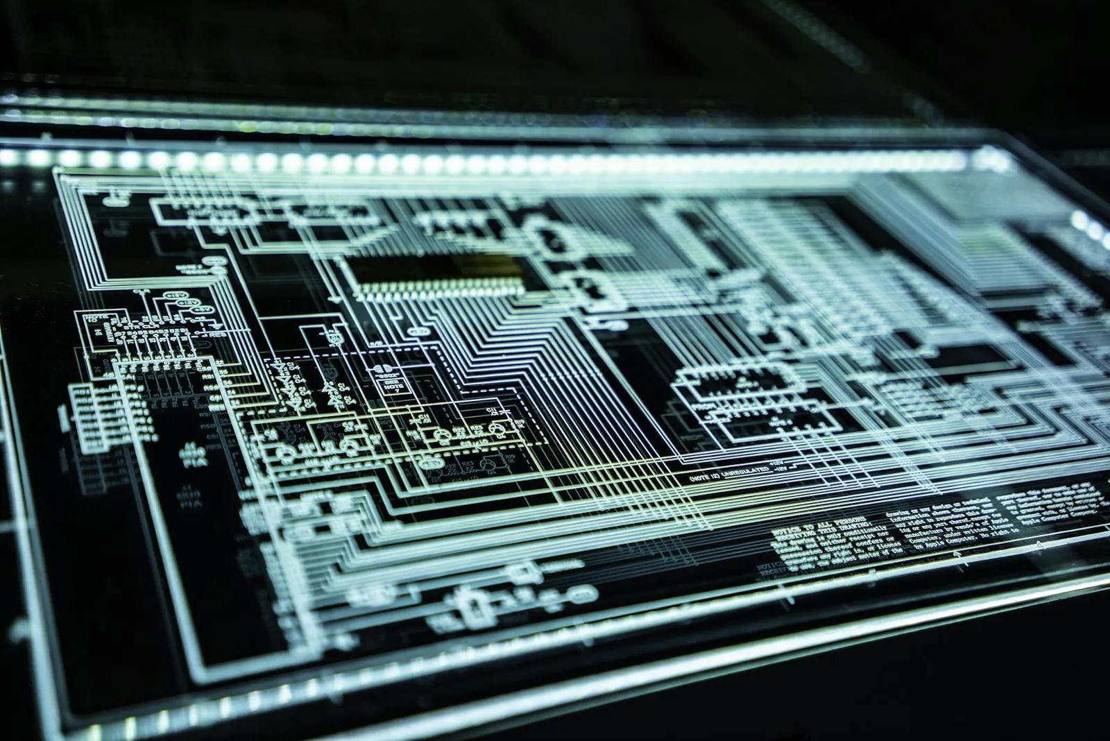 A teal LED panel with abstract light patterns