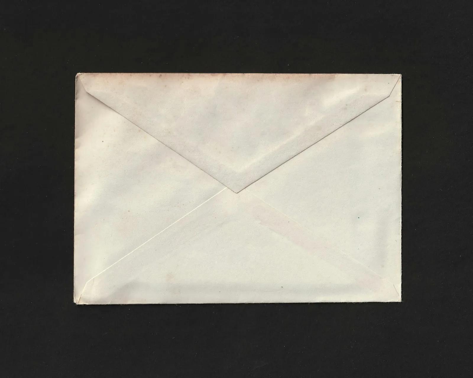 A single white envelope on a black background