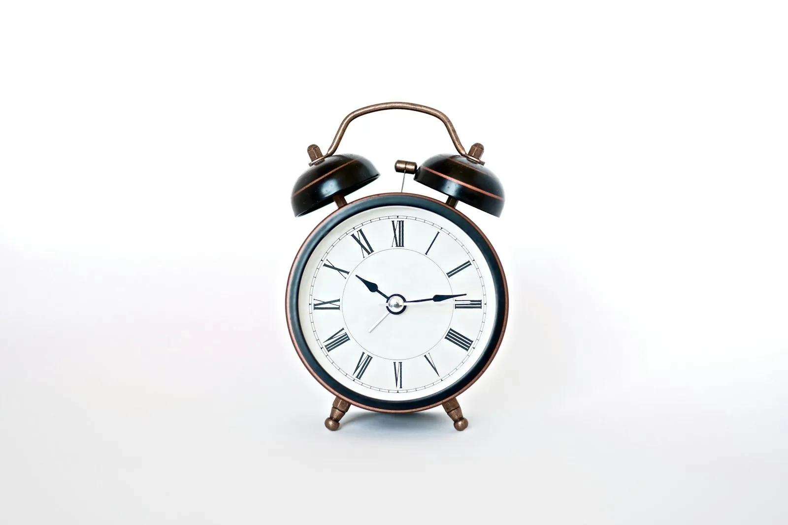 Black and white analog alarm clock