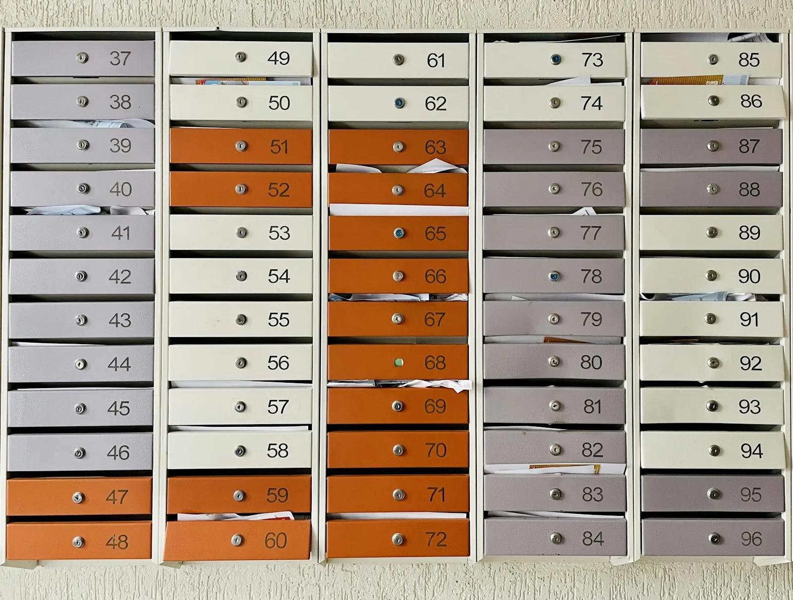 Wall of numbered mailboxes