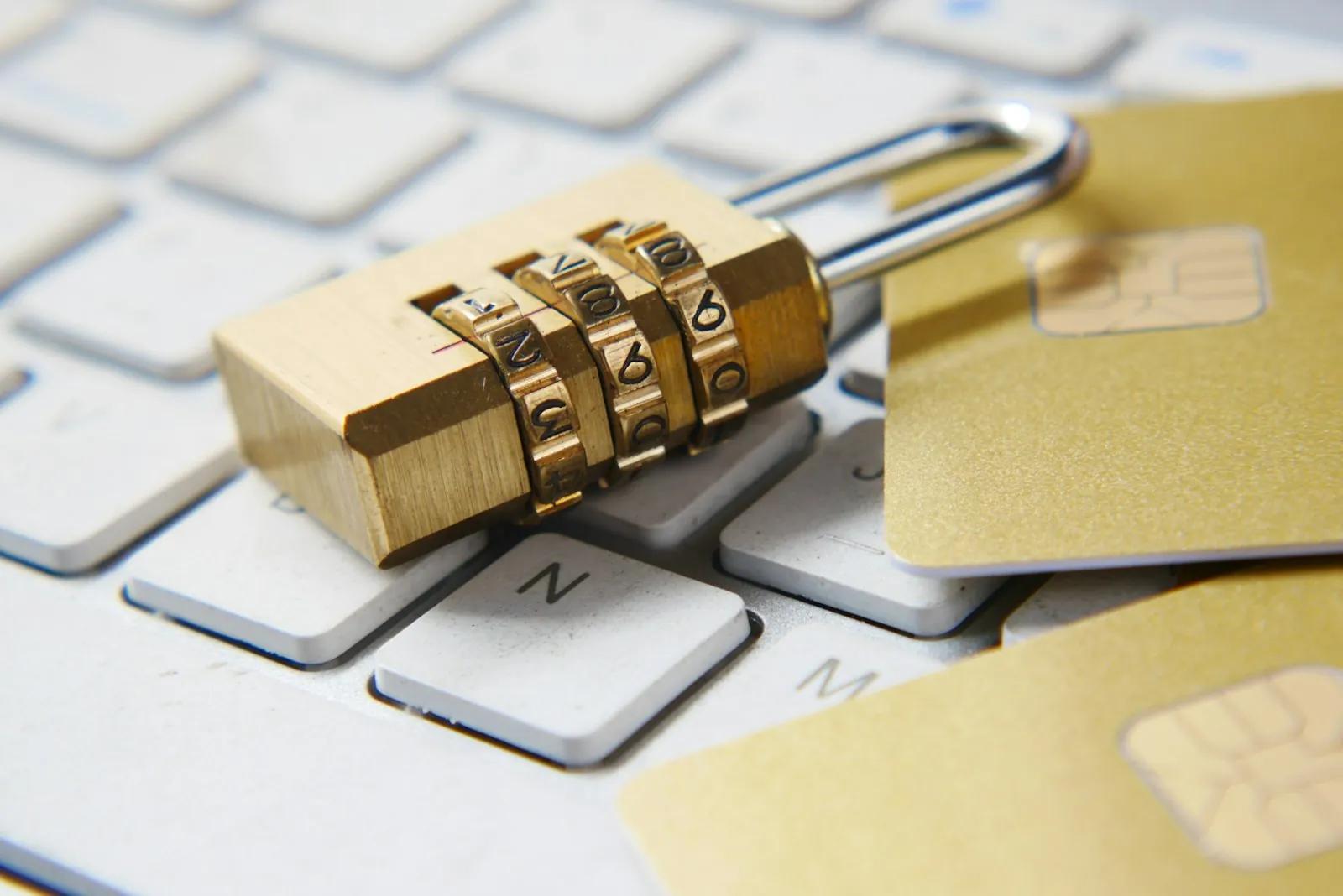 Gold padlock sitting on a keyboard