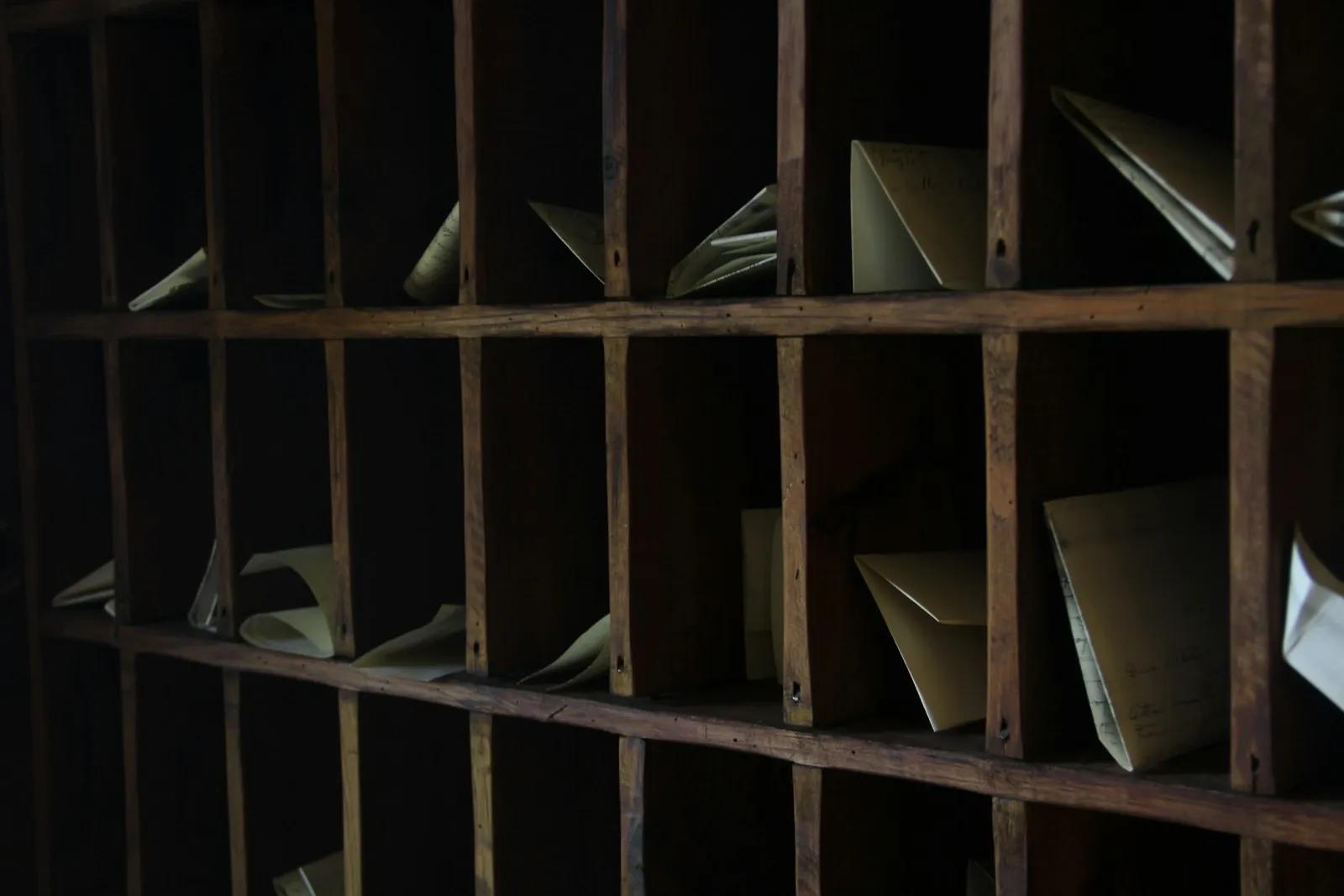 Wooden mail rack with sorting slots