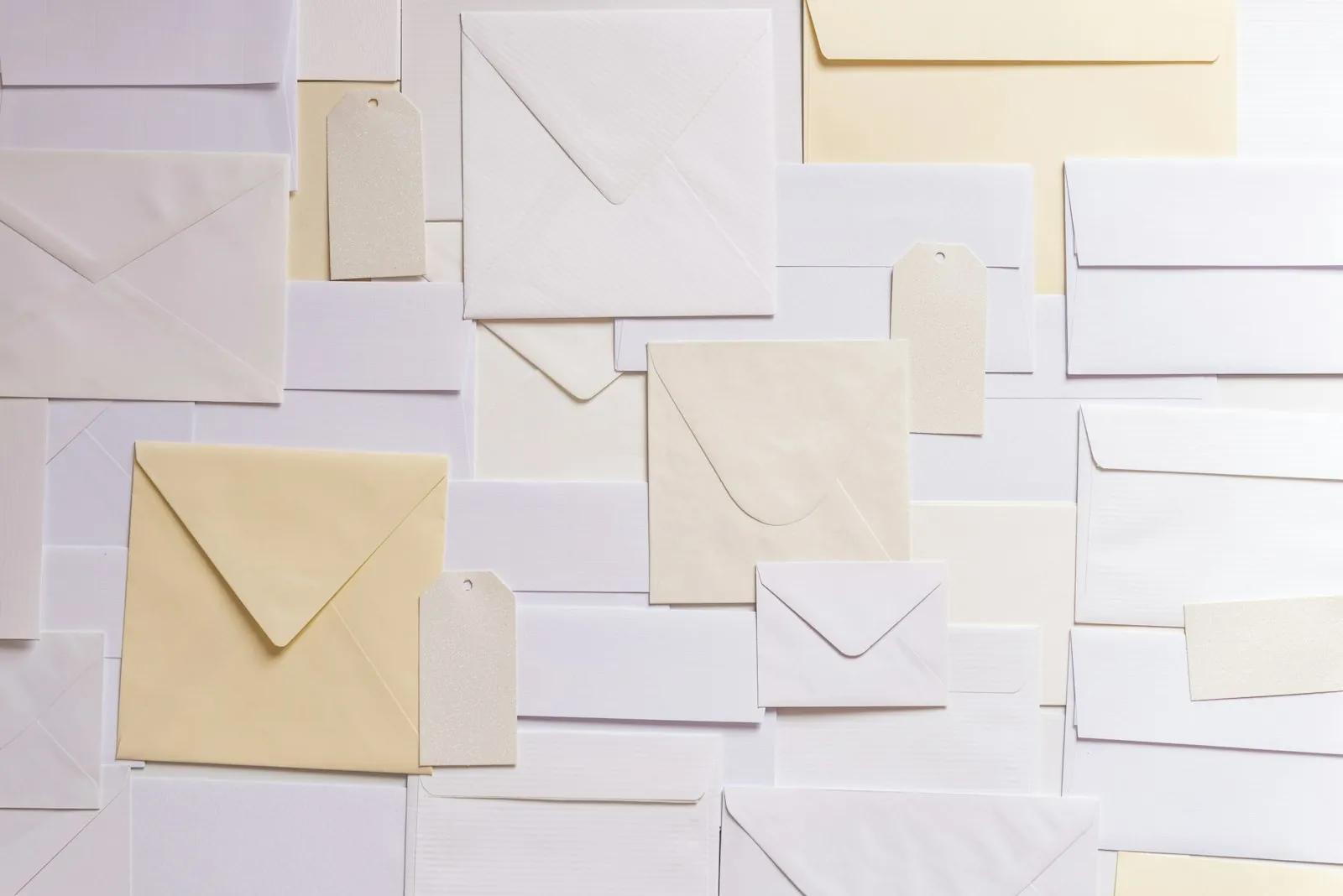 Paper envelopes and tags laid out on a flat surface